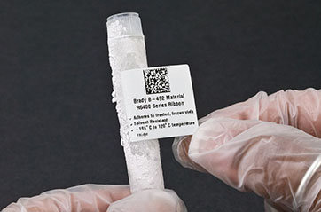 A Brady R6400 ribbon label capable of resisting solvents sticks to a completely frozen vial.